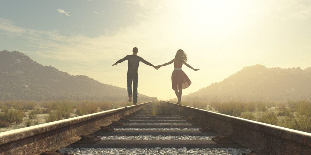 The young couple The young couple walking on a railway track. This is a 3d render illustration